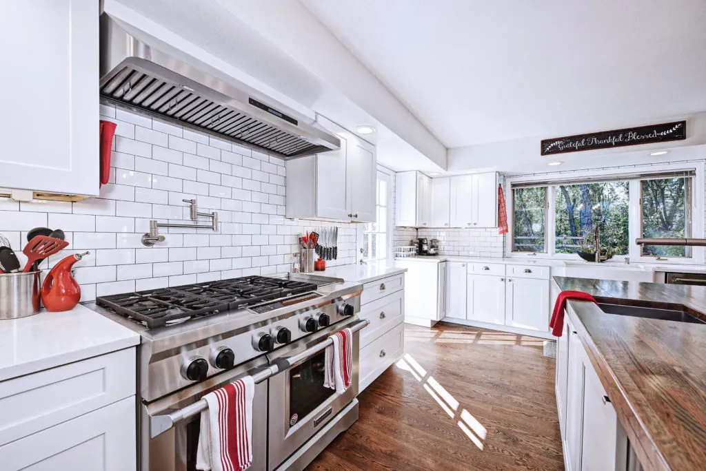 Cabinetry and sink area with granite surfaces